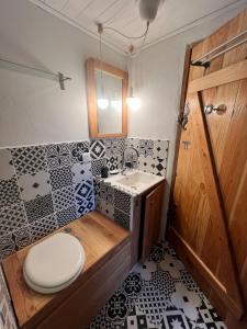 a bathroom with a toilet and a sink at Charming apartment in Nyons in Nyons +9 photos
