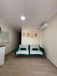 a bedroom with a bed in the corner of a room at PENSIÓN ISBEL in Málaga