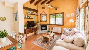 a living room with a couch and a table at La Casa de Pría in Garaña