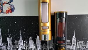 a close up of two different types of lipstick and a phone at APPLE PARADISE, House of mirrors, self check-in, FREE PARKING in Riga