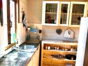 a kitchen with a sink and a counter top at Port Nolloth Beach Shack in Port Nolloth +71 photos