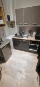 a kitchen with a sink and a counter top at Urban Duo Saumur in Saumur