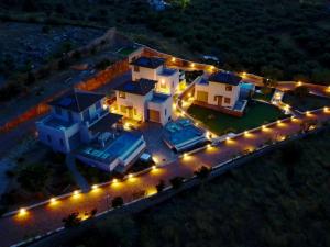 an aerial view of a house at night with lights at Aqua villa Studio II in Elafonisos