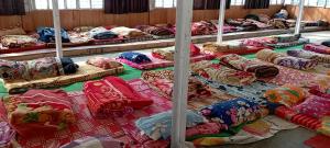 a room filled with lots of pillows and blankets at Himalayan siddhi yog aashram in Badrinath +9 photos