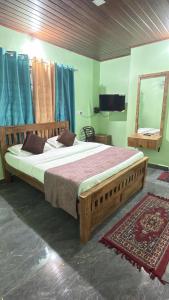 a bedroom with a large wooden bed and a mirror at CENTAURUS Coorg HOMESTAY in Madikeri