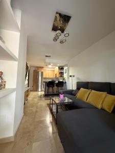 a living room with a couch and a table at Ónice de Riviera 2 in Mijas Costa