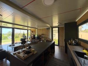 a kitchen with a large island in a room at Retreat House Mao in Petrovaradin