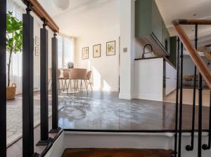 an open hallway with a staircase in a house at Spacious Designer Duplex 9 Guests Fully Renovated in Châtillon
