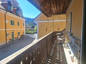 a balcony of a building with a view of a street at Schwarze Gräfin in Spital am Pyhrn