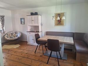 a dining room with a wooden table and chairs at Schwarze Gräfin in Spital am Pyhrn