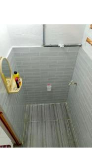 a bathroom with a sink and a mirror at Homestay Bakti in Bandar  Pusat Jengka