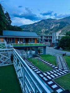 a view of a building from a balcony at Valledor Resort in Bālākot