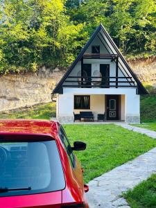 a car parked in front of a house at Mountain Holiday Homes in Kostel