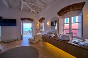 a large bathroom with two sinks and a large window at Casa Zacco in Parga