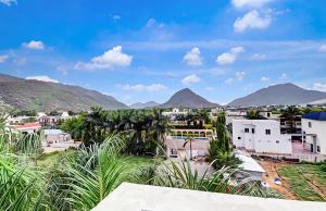 a view of a town with mountains in the background at Hotel Namaste Pushkar in Pushkar