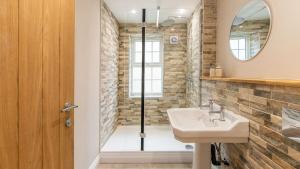 a bathroom with a sink and a shower at Newly Renovated 2-Bed Flat | Ripon Town Centre in Ripon