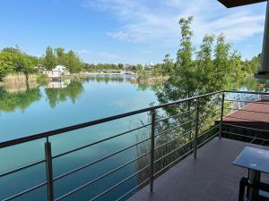 a view of a river from a balcony at Sentio Inn 2 in Dunajská Streda