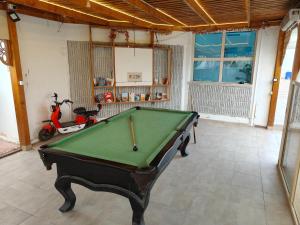 a room with a pool table and a scooter in it at Porto View in Hurghada