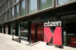 a building with a sign in front of it at citizenM Amsterdam South in Amsterdam