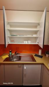 a kitchen with a sink and a counter top at Messe-clarastrasse -Wohnung in Basel