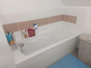 a bathroom with a sink and a bath tub at Coutances in Coutances