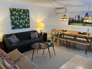 a living room with a couch and a table at Bienvenido a Chez Matu in Capdepera