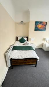 a bedroom with a bed in a room at Stirling Steet in Wallasey