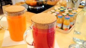 two glass mugs of juice sitting on a table at Ca' Bianca in Lugo