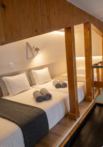 a bedroom with a bed with two pillows on it at Orchard in Athens