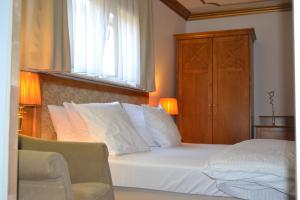 Postel nebo postele na pokoji v ubytování Hotel The Lord