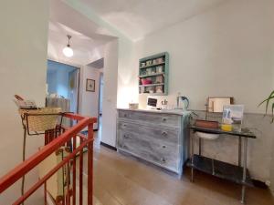 a room with a dresser and a desk in it at Iridea in Lamoli Di Borgo Pace