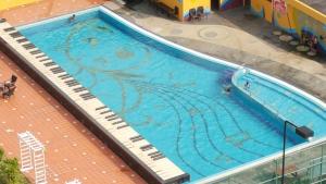an overhead view of a large swimming pool at Famosa D Savoy 3-Bedroom Condo in Alor Gajah in Melaka +5 photos