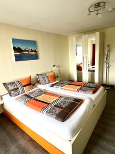 a bedroom with two beds in a room at Gaestehaus Seliger in Meersburg