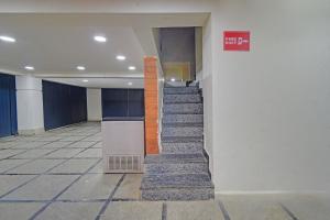 a hallway of a building with stairs in it at FabHotel Casa Grand Ecil in Hyderabad +22 photos
