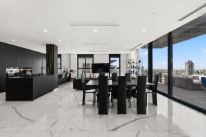 an open kitchen and dining room with a table and chairs at Sky High 15 Choose Between 2 Luxury Penthouses in Beer Sheva