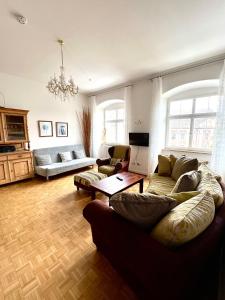 a living room with a couch and a table at FeWo Seliger am Schloßplatz in Meersburg
