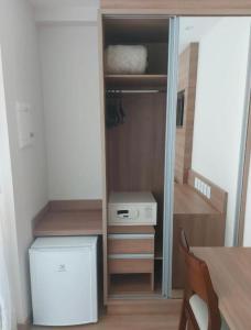 a small closet with a door open to a room at VISTA AZUL Prime in Domingos Martins +26 photos