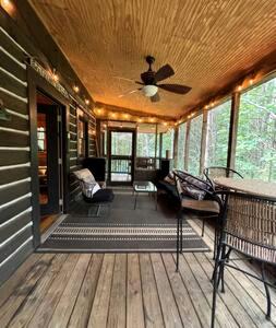 a screened in porch of a house with a ceiling at Cedar Gap Hideaway in Indiana in Birdseye