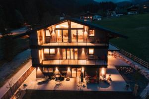 an aerial view of a house at night at ANN SUITES Appartements in Filzmoos
