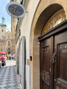 a door to a building with a sign above it at Prague Golden Age in Prague +70 photos