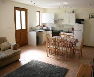 a kitchen with a table and chairs in a room at ASpace Gites in Parthenay