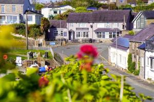 a view of a town with houses and a street at Glan Y Don Moelfre in Moelfre +28 photos