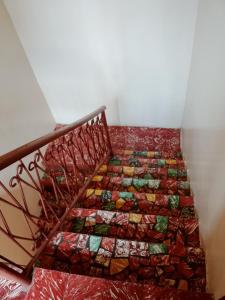 a set of stairs with a quilt on them at Comfy room in Wilkinson road ft in Freetown