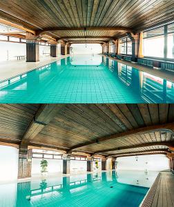 a large swimming pool with a wooden ceiling at Peaceful Oasis Black Forest in Schonach