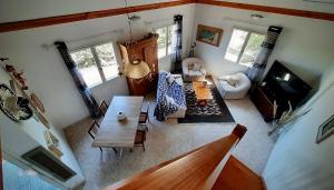an overhead view of a living room with a table at Piscine & Vue Mer, Maison Familiale Corse, accès cascade in Santa-Maria-Poggio