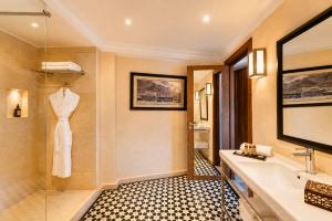 a bathroom with a sink and a shower at Hivernage Marrakech in Marrakesh +82 photos
