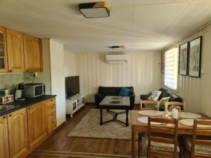 a living room with a couch and a table at Søvikhus in Haram
