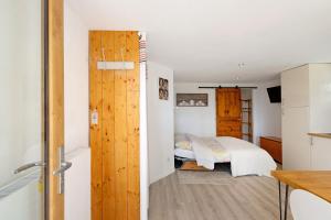 a small bedroom with a bed and a closet at Sorbier Des Oiseaux in Font-Romeu