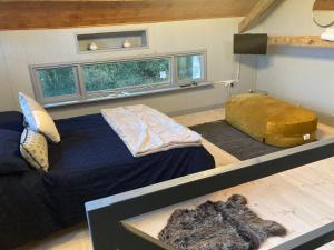 a bedroom with a large bed in a room at The Stable Sleeps 2 with Parking in Llanfairpwllgwyngyll