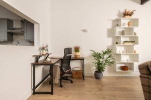 an office with a desk and a chair at Aintree Cottage in Cirencester